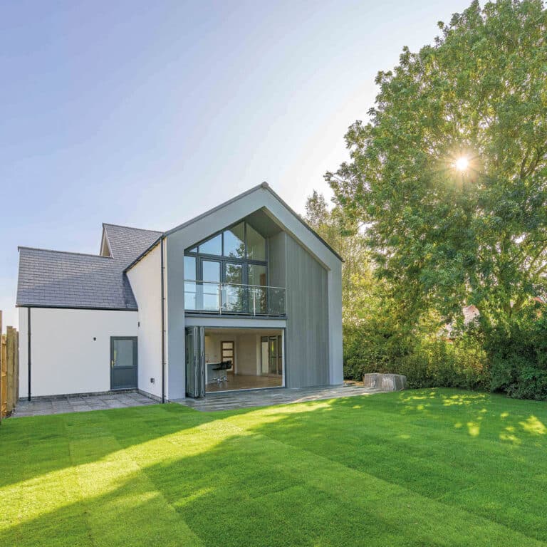 The back garden of a modern house with ecorend rendering