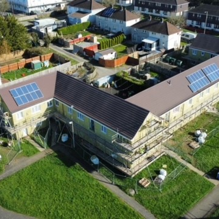 Houses under construction with solar panels.