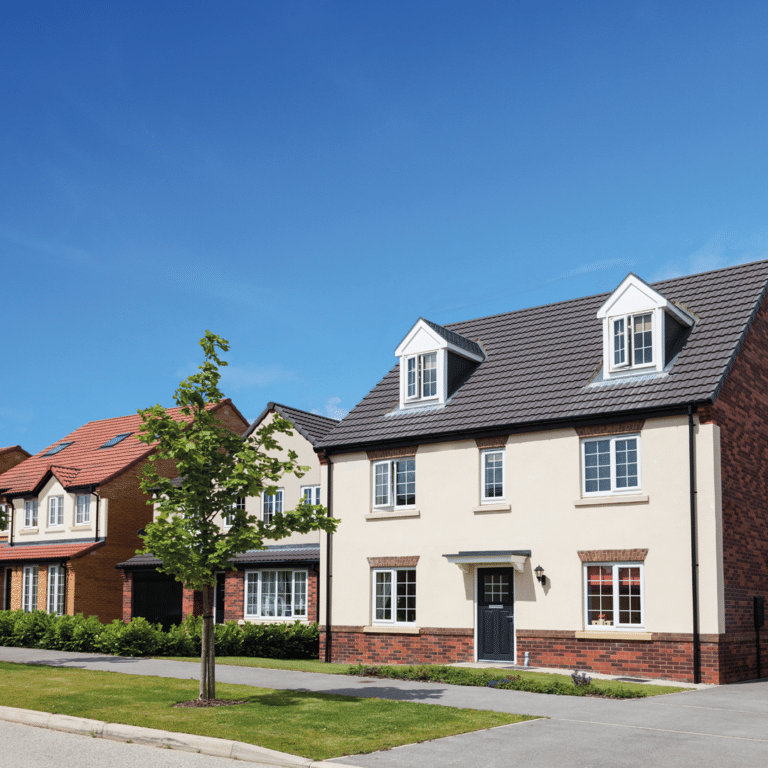 Modern houses under clear blue sky