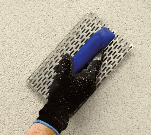 Scratching back white monocouche render