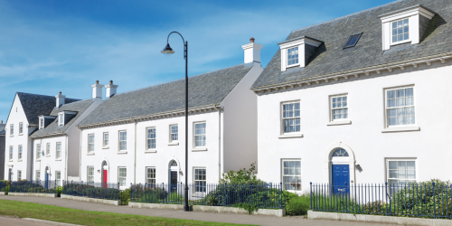 White rendered houses on a road