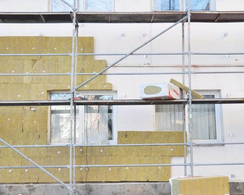 Mineral wool being installed as part of an EWI installation