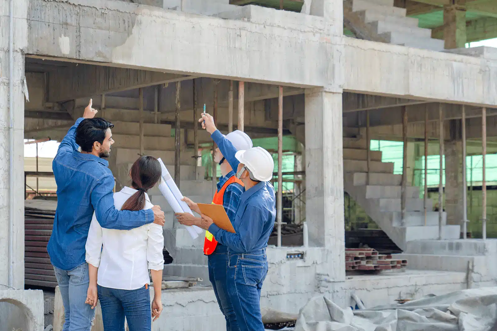 Construction team discussing building plans.