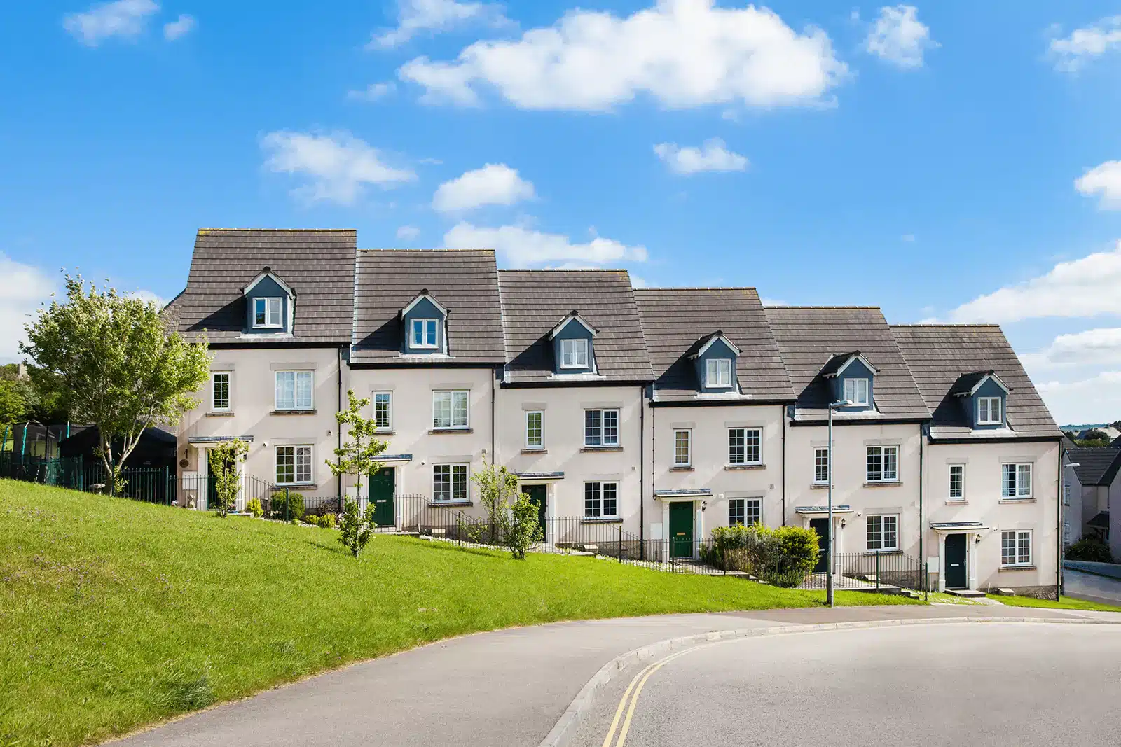 Row of modern suburban houses featuring a low-carbon render finish