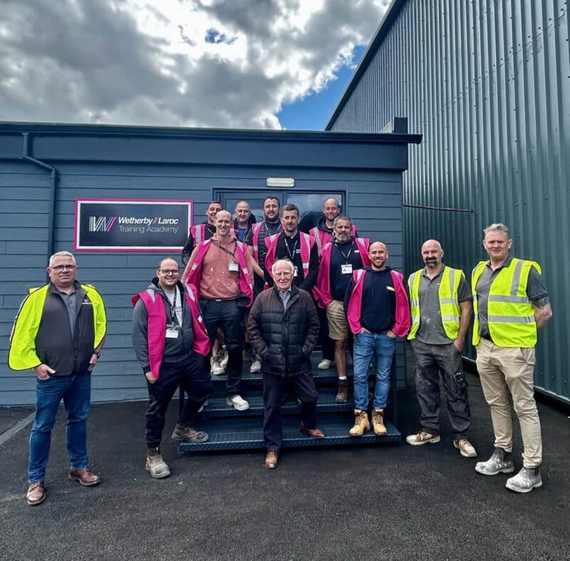 Group photo of happy contractors at a render training academy day in North Yorkshire